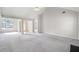 Large open living room with fireplace, and transitional flooring at 4768 Score Ct, Snellville, GA 30039