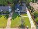Aerial view of a well-maintained property with lush green lawn and a long driveway at 672 Quillian Ave, Decatur, GA 30032