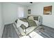 Bedroom with a ceiling fan, two windows, a modern style rug, and a cozy bed at 672 Quillian Ave, Decatur, GA 30032