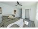Bedroom with a ceiling fan, walk-in closet, and a cozy bed at 672 Quillian Ave, Decatur, GA 30032