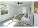 Bedroom with a ceiling fan, two windows, a modern style rug, and a cozy bed at 672 Quillian Ave, Decatur, GA 30032