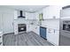 Bright kitchen featuring gray floors, white cabinets, subway tile backsplash, and stainless steel appliances at 672 Quillian Ave, Decatur, GA 30032