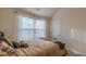 Well-lit bedroom featuring neutral decor and a vaulted ceiling at 879 Tranquil Way, Hampton, GA 30228