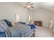 Bedroom featuring carpet, a ceiling fan, neutral paint and vaulted ceiling at 879 Tranquil Way, Hampton, GA 30228