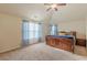 Spacious bedroom with a ceiling fan, carpet, and a large window at 879 Tranquil Way, Hampton, GA 30228