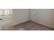 This bedroom features a door and carpeted floors at 879 Tranquil Way, Hampton, GA 30228