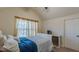 Cozy bedroom with a vaulted ceiling and ample natural light from the window at 879 Tranquil Way, Hampton, GA 30228