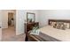 Cozy bedroom features a sleek dresser with a mirror and a comfortable bed with decorative pillows at 879 Tranquil Way, Hampton, GA 30228