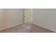 This bedroom features a door and carpeted floors at 879 Tranquil Way, Hampton, GA 30228