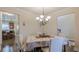 Cozy dining room blending into the open layout, perfect for both casual and formal dining experiences at 879 Tranquil Way, Hampton, GA 30228