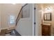 Inviting entryway with a staircase, half bathroom, and stylish flooring at 879 Tranquil Way, Hampton, GA 30228