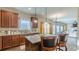 Bright kitchen featuring stainless steel appliances, granite countertops, and an island with bar seating at 879 Tranquil Way, Hampton, GA 30228