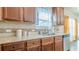 Well-lit kitchen area featuring stainless steel appliances, granite countertops, and an abundance of storage at 879 Tranquil Way, Hampton, GA 30228