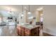 Open-concept kitchen island, great for entertaining guests in the well-lit living space at 879 Tranquil Way, Hampton, GA 30228