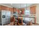 Modern kitchen with stainless steel appliances and granite countertops, offering a blend of style and functionality at 879 Tranquil Way, Hampton, GA 30228