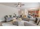 Open-concept living room with a view of the kitchen and staircase at 879 Tranquil Way, Hampton, GA 30228