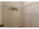 Functional walk-in closet with wire shelving and carpeted floor at 879 Tranquil Way, Hampton, GA 30228