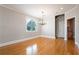 Elegant dining area featuring hardwood floors, chandelier and views of the staircase at 140 Ryan Ln, Covington, GA 30014