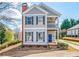 Charming two-story home features a welcoming front porch and a well-manicured front yard at 140 Ryan Ln, Covington, GA 30014