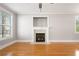 Bright living room with hardwood floors, fireplace and large windows with blinds at 140 Ryan Ln, Covington, GA 30014