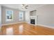 Bright living room with hardwood floors, fireplace and large windows with blinds at 140 Ryan Ln, Covington, GA 30014