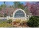 Apalachee Heritage community entrance featuring a stone sign surrounded by beautiful landscaping at 2688 Stockbridge Way, Dacula, GA 30019