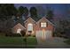 Charming two-story brick home with a well-manicured front yard and a two-car garage at 2688 Stockbridge Way, Dacula, GA 30019