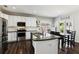 Bright kitchen with stainless steel appliances, white cabinets, and a breakfast nook; ideal for casual dining at 2688 Stockbridge Way, Dacula, GA 30019
