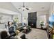 Open concept living room with fireplace, natural light, and seamless flow to the breakfast area at 2688 Stockbridge Way, Dacula, GA 30019