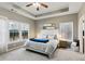 Serene main bedroom boasts a tray ceiling, soft natural light, and ample space at 2688 Stockbridge Way, Dacula, GA 30019