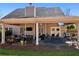 Expansive covered patio with multiple seating areas and outdoor kitchen at 2688 Stockbridge Way, Dacula, GA 30019