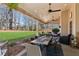 Large covered patio with dining and lounge areas for outdoor enjoyment at 2688 Stockbridge Way, Dacula, GA 30019