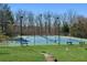 Community tennis courts with well-maintained surfaces, lighting, and benches for players at 2688 Stockbridge Way, Dacula, GA 30019