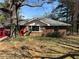 Charming one story brick home with a covered porch and mature trees offering shade at 496 Elizabeth Sw Ln, Mableton, GA 30126