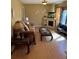 Cozy living room with laminate flooring, a fireplace, and neutral wall paint at 496 Elizabeth Sw Ln, Mableton, GA 30126