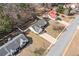 Aerial view of a suburban house showing the roof, driveway, and the landscape of the yard at 55 Vintage Dr, Covington, GA 30014