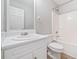 Functional bathroom with combined shower and tub, white vanity, and updated fixtures at 55 Vintage Dr, Covington, GA 30014