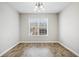 Charming dining room with wood floors, and large window perfect for Gathering meals at 55 Vintage Dr, Covington, GA 30014