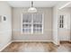 Bright dining area with a large window and stylish light fixture at 55 Vintage Dr, Covington, GA 30014