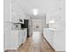 Efficient kitchen with white cabinets and modern appliances at 55 Vintage Dr, Covington, GA 30014