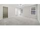 Spacious main bedroom with plush carpet, natural light, and ensuite bath at 55 Vintage Dr, Covington, GA 30014