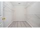 Organized walk-in closet with built-in shelving for optimal storage at 55 Vintage Dr, Covington, GA 30014