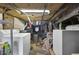 Unfinished basement with laundry area, exposed pipes, and brick foundation at 818 Virgil Ne St, Atlanta, GA 30307