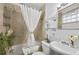 Bathroom with tiled walls, a shower-tub combo, and decor at 818 Virgil Ne St, Atlanta, GA 30307
