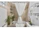 Shower-tub combination with tiled walls and decorative flowers at 818 Virgil Ne St, Atlanta, GA 30307