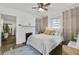 Bedroom with a decorative fireplace, ceiling fan and natural light at 818 Virgil Ne St, Atlanta, GA 30307