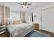 Bright bedroom featuring a ceiling fan, and original wood floors at 818 Virgil Ne St, Atlanta, GA 30307