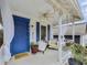 Inviting front porch with comfortable seating, blue door, and decorative details at 818 Virgil Ne St, Atlanta, GA 30307