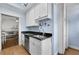 Kitchen featuring white cabinets, a stainless steel sink, and black countertops at 818 Virgil Ne St, Atlanta, GA 30307