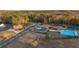 Aerial view of the community amenities, including a pool and tennis courts at 1868 Lacebark Elm Way, Lawrenceville, GA 30045